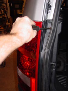 take out screws to remove tail light